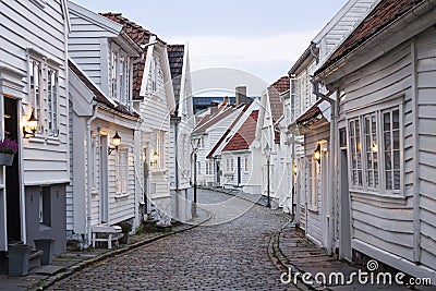 Traditional scandinavian cobblestone street with white houses in Stavanger, Norway Stock Photo