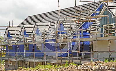 Houses under construction with thermal lagging. Stock Photo