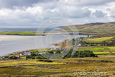 Houses, Vegetation, mountains and ocean in Achill Island Stock Photo
