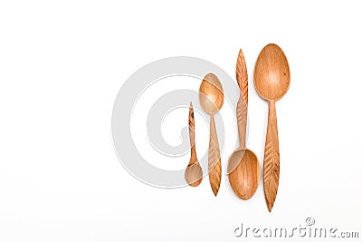 Houseware: wooden kitchen spoons, isolated on white background top view. Zero waste, eco friendly concept. Flat lay Stock Photo