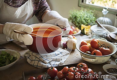 A housewife cooking tomato sauce food photography recipe idea Stock Photo