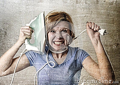 Housewife or maid domestic service woman holding upset an iron strangling her neck Stock Photo