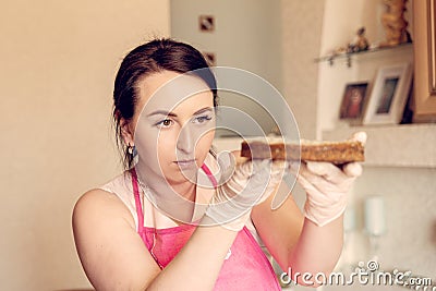 Housewife pastry chef checks the cake of the future cake for correctness Stock Photo