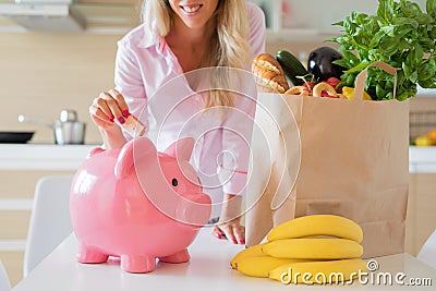 Woman saving money with smarter shopping Stock Photo