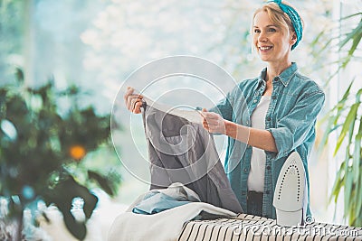 Housewife sorting clean laundry Stock Photo