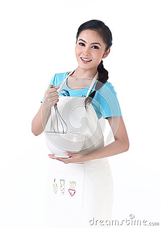 A housewife stirring eggs Stock Photo