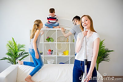 Housewife vaccuum cleaning Stock Photo