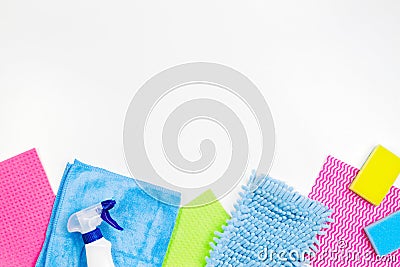 Housework, housekeeping, household, cleaning service concept. Bottle of detergent, rags and sponges on white background Stock Photo