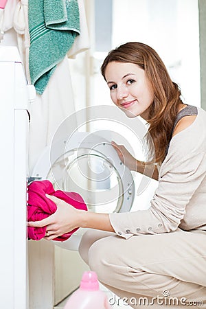 Housework: young woman doing laundry Stock Photo