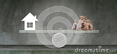 Housing loan market Sample houses and balance piggy bank on the seesaw Real estate concepts Stock Photo