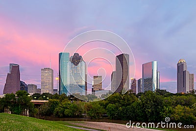 Houston Texas skyline at sunset twilight from park lawn Stock Photo