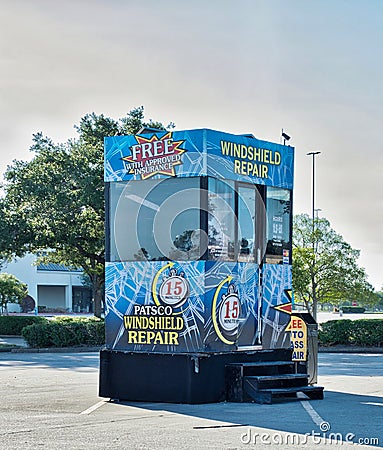 Patsco Windshield Repair business kiosk booth in a commercial parking lot in Houston, TX. Editorial Stock Photo