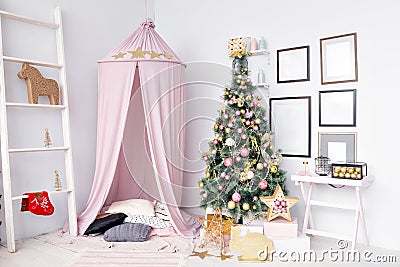 Hovel prepared for children. Beautiful New Year decor of the children room Christmas house. Stock Photo
