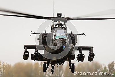 A hovering Apache attack gunship helicopter Stock Photo