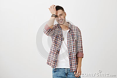 How could I forget that story. Portrait of excited happy attractive unshaven man in trendy glasses holding hand on Stock Photo