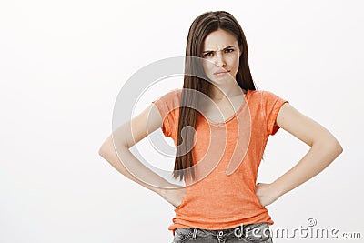 How could you forget about my birthday. Portrait of offended upset beautiful woman, holding hands on hips and frowning Stock Photo