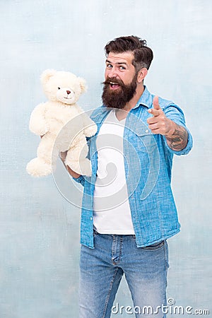 How do you like it. toy shop concept. happy birthday party. brutal hipster hold lovely bear toy. valentines day present Stock Photo