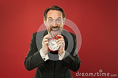 How much time left till deadline. Manager with alarm clock. Man bearded businessman hold clock. Mature man beard ready Stock Photo