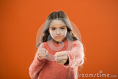 How teach kids to defend themselves. Self defense strategies kids can use against bullies. Girl hold fists ready attack Stock Photo