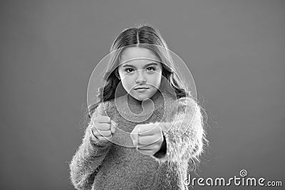 How teach kids to defend themselves. Self defense strategies kids can use against bullies. Girl hold fists ready attack Stock Photo