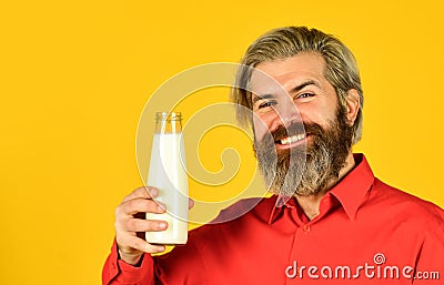 How to be dairy free. Lactose intolerance. Bearded man hold milk bottle. Pasteurized milk. Vegan milk concept. Drink Stock Photo