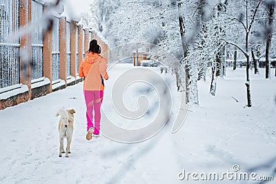 How to Deal With Stray Dogs While Running Outdoors. Running and jogging and street dogs. Runner woman meeting Stray Dog Stock Photo