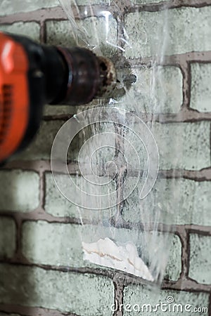 How to drill wall by protecting dusty in the room. Stock Photo