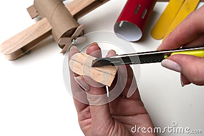 How to make airplane. Hand made toy,zero waste from toilet paper roll and popsicle sticks. For kids and parents. Step 20 propeller Stock Photo
