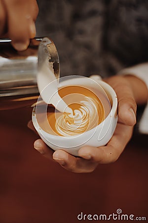 How to make coffee latte art by barista in vintage color tone Stock Photo