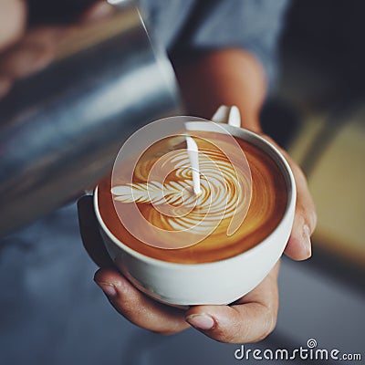 How to make coffee latte art by barista in vintage color tone Stock Photo