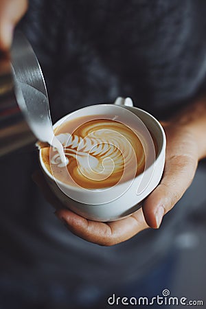 How to make coffee latte art by barista in vintage color tone Stock Photo