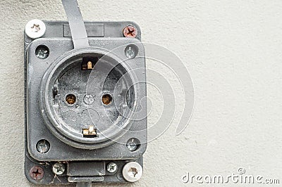 How to remove the electrical outlet on the facade of the house and fix it on the wall Stock Photo