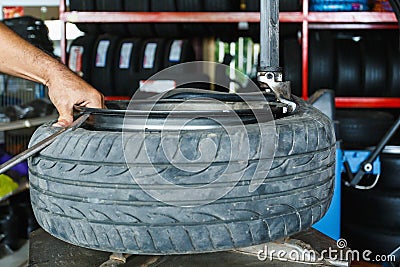 How to remove the tire from the car Alloy Wheels. Stock Photo