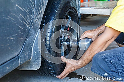 How to remove the tire from the car Alloy Wheels. Stock Photo