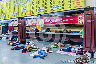 HOWRAH, INDIA - OCTOBER 27, 2016: Local people sleeping at Howrah Junction railway station in Indi Editorial Stock Photo