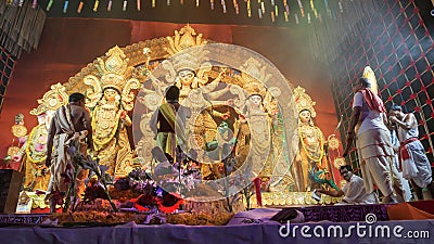 Hindu Purohits offering Vog, holy sweet food for Goddess Durga while worshipping Editorial Stock Photo