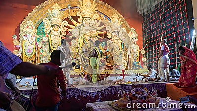 Howrah, West Bengal, India - 5th October, 2022 : Hindu Purohits offering Vog, holy sweet food to Goddess Durga while Dhaakis Editorial Stock Photo
