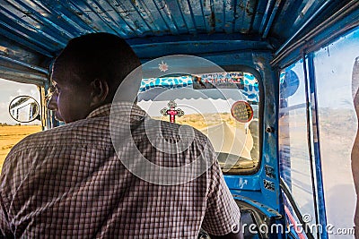 HOWZIEN, ETHIOPIA - MARCH 22, 2019: Tuk tuk (bajaj) driver near Howzien, Tigray region, Ethiop Editorial Stock Photo