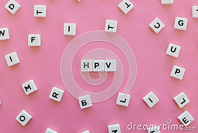 HPV & x28;Human Papillomavirus& x29; acronym word made of square letter word on pink background. Stock Photo