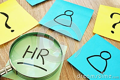 HR human resource written on a stick and magnifier. Stock Photo