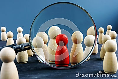 HR human resources and Recruitment. Wooden figures and magnifying glass Stock Photo