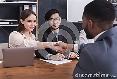 HR manager shaking hands with applicant at interview Stock Photo