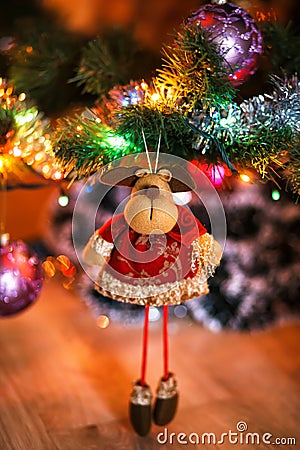 Ð¡hristmas deer stuffed toy on Christmas tree. Stock Photo