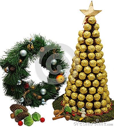 Ð¡hristmas tree of golden chocolates on white background. Stock Photo