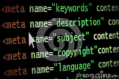 HTML web page computer programming code meta tags in red light and dark green with mouse pointer on black background seo Stock Photo