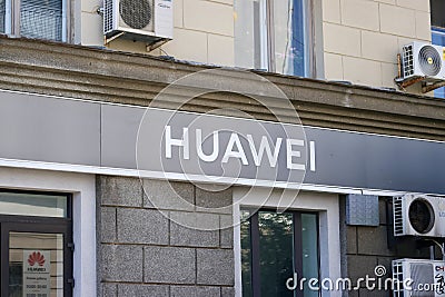 The Huawei company logo on the facade of the building Editorial Stock Photo