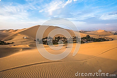 Hucachina oasis in sand dunes near Ica, Peru Stock Photo