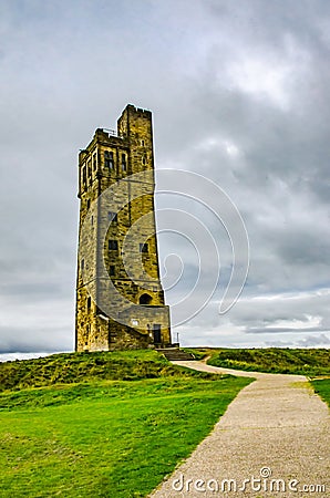 Huddersfield, West Yorkshire, England September 20 2107: Victoria Tower Castle Hill Huddersfiled. Stone tower on hill with path Editorial Stock Photo