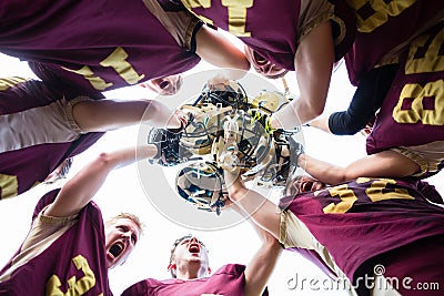 Huddle after victory at American Football Team Stock Photo