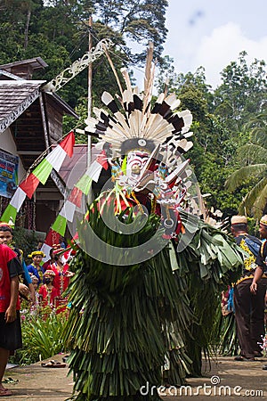 Hudoq dancers from the Bahau Dayak tribe dancing together, in West Kutai, East Kalimantan Editorial Stock Photo